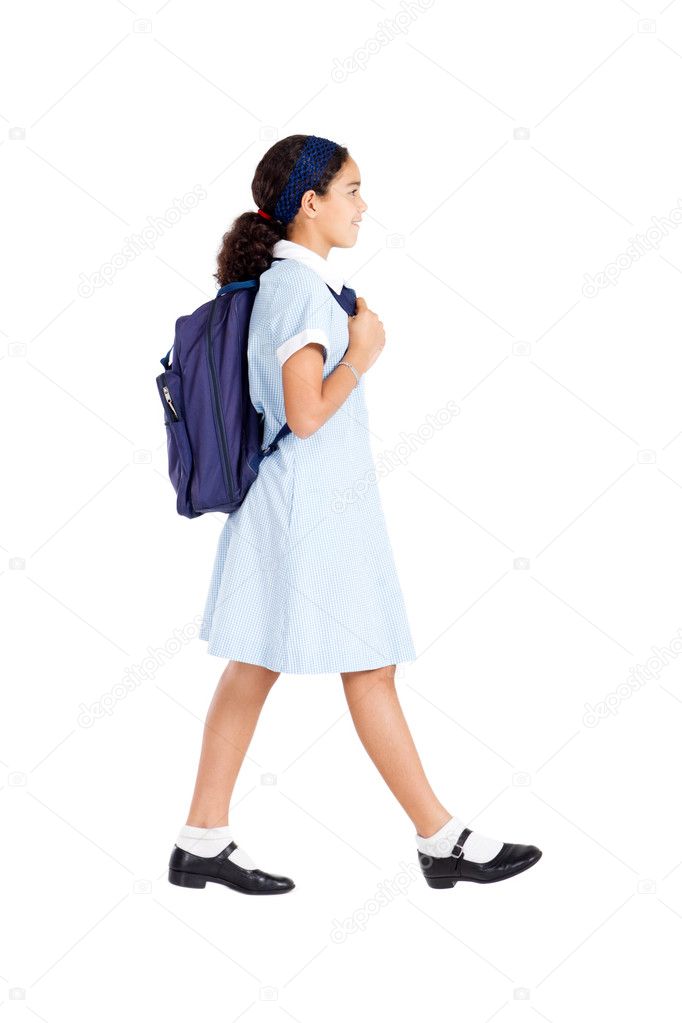 Schoolgirl carrying schoolbag and walking
