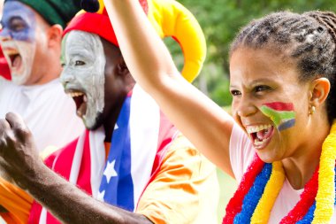 Excited sports fans watching a game clipart