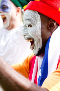 Excited super sports fans watching a game clipart