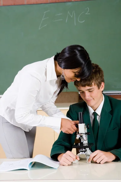 Young teacher teaching student — Stock Photo, Image