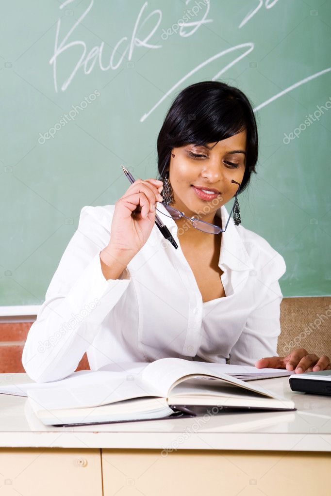 Female school teacher working in classroom