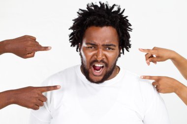 Fingers pointing at angry overweight african american man clipart