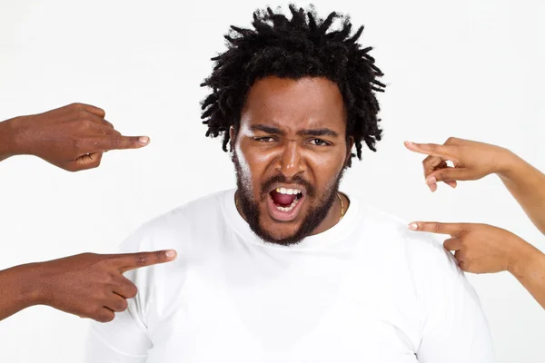 Fingers pointing at angry overweight african american man — Stock Photo, Image