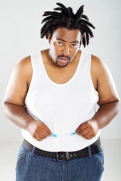 Gordo homem africano com fita métrica — Fotografia de Stock
