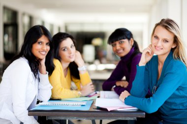 Group college students sitting by cafeteria clipart