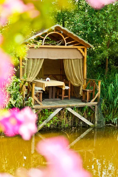 stock image Wooden cozy gazebo for relaxing