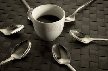 Coffee and teaspoons still life clipart