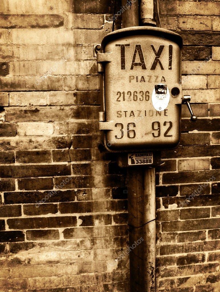 Vintage taxi sign on brick wall Stock Photo by ©bluneo 11958159