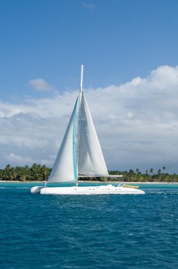 Landscape of Atlantic Ocean. Caribbean paradize. White pleasure boat - catamaran clipart