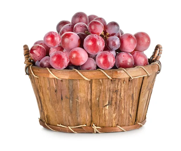 Dark blue grapes in a wooden basket isolated — Stock Photo, Image