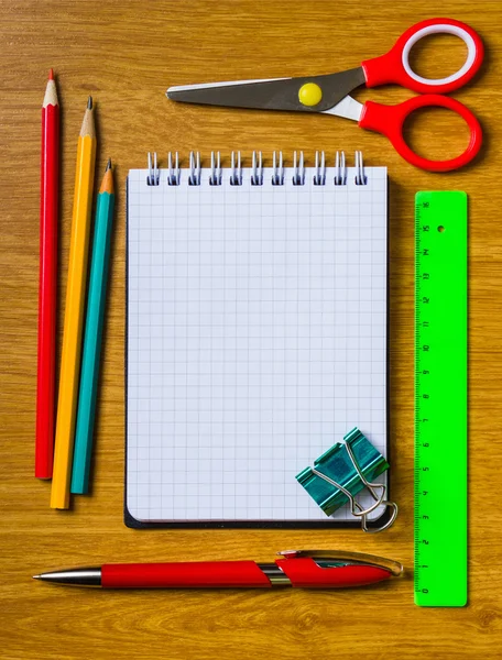 Still life of office supplies with a notebook — Stock Photo, Image