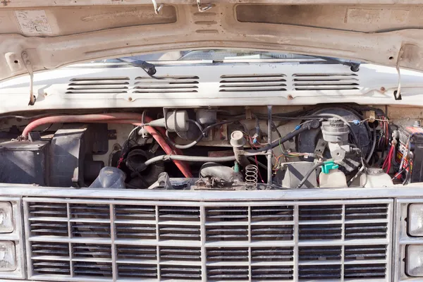 stock image Open hood of old van shows engine and front grille