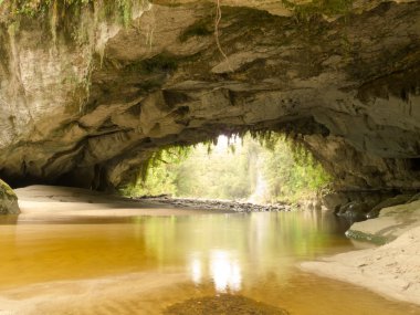 Moria Gate Arch in Opara Basin, South Island, NZ clipart