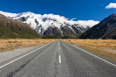 Road leading into Aoraki Mt Cook National Park NZ clipart