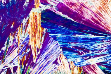 Hydroquinone crystals in polarized light clipart