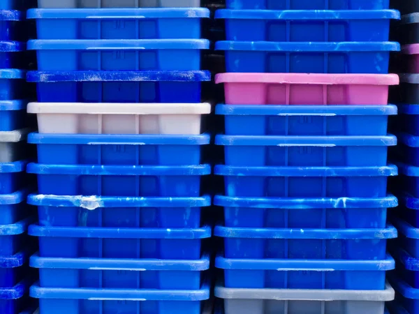stock image Stack of empty colorful plastic fishery containers