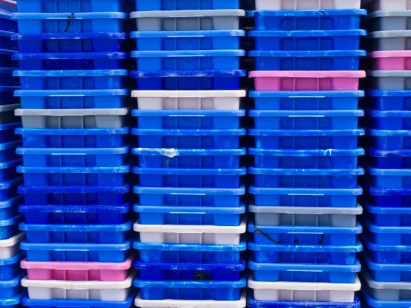 Stack of empty colorful plastic fishery containers — Stock Photo, Image