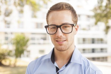 Business Man Portrait, Builgind in background clipart