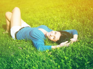 Young woman joy and relaxing in park clipart