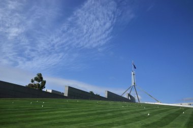 The imposiing structure of the flag pole atop Australia's Parliament House clipart