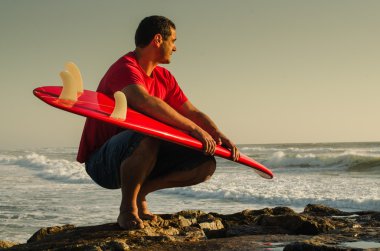 Surfer watching the waves clipart