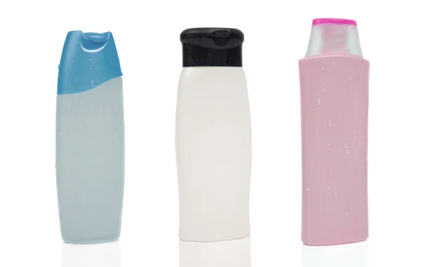 Три пустые бутылки шампуня — стоковое фото