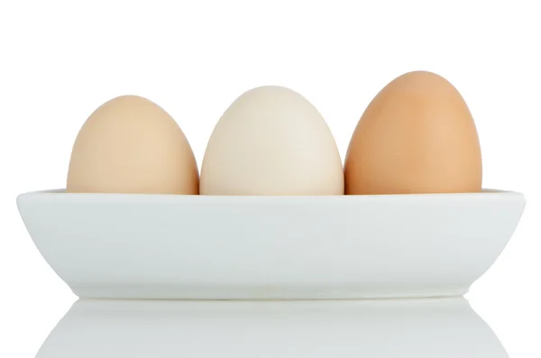 Huevos marrones en tazón de cerámica blanca — Foto de Stock