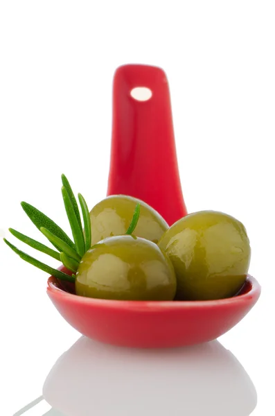 Olives on ceramic spoon — Stock Photo, Image