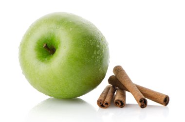 Ripe green apple with cinnamon sticks clipart