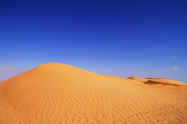 Dunes and blue sky clipart