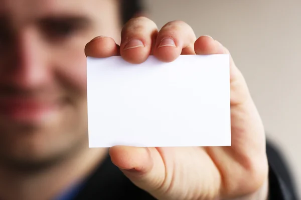 Businessman shows business card — Stock Photo, Image