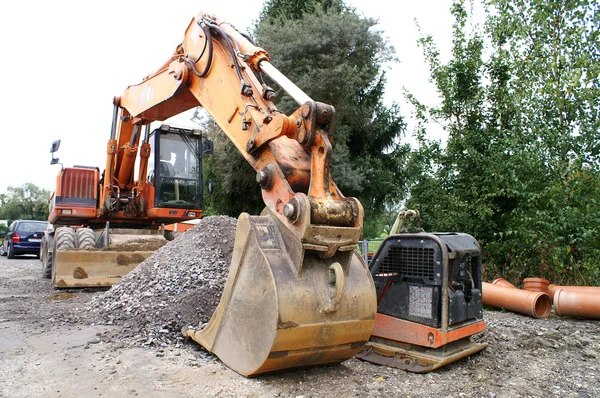 Excavadora trabajando en el sitio de construcción —  Fotos de Stock