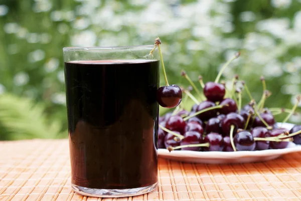 Glass of natural fresh cherry juice — Stock Photo, Image