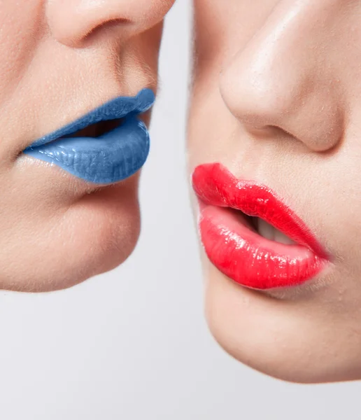 Красные и синие губы — стоковое фото