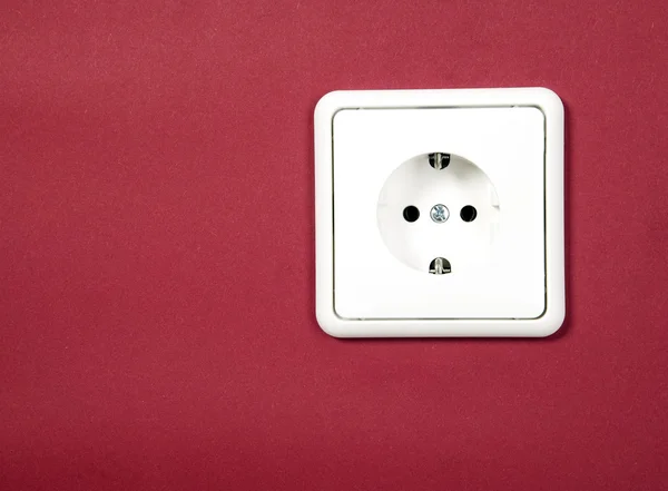 White socket on red background — Stock Photo, Image
