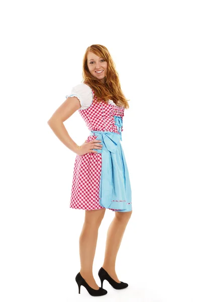 Standing young redhead woman in bavarian dress — Stock Photo, Image