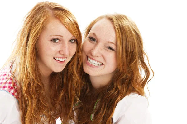 Two happy redhead bavarian dressed girls — Stock Photo, Image