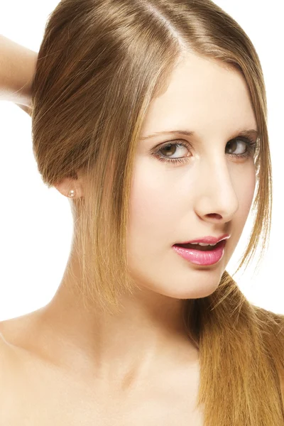 Güzel bir kadın saçlarını bir helezon holding — Stok fotoğraf