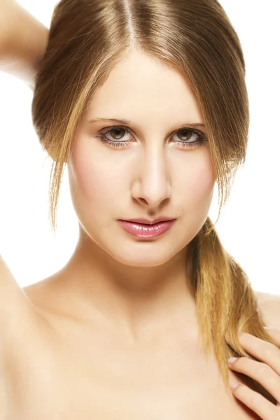 Young beautiful woman holding her pigtail — Stock Photo, Image