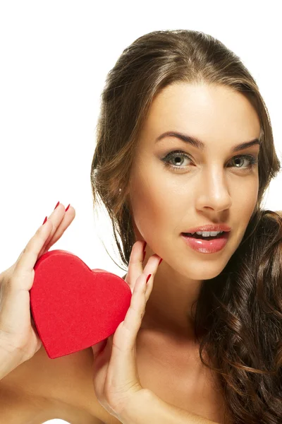Beautiful woman presenting red heart — Stock Photo, Image