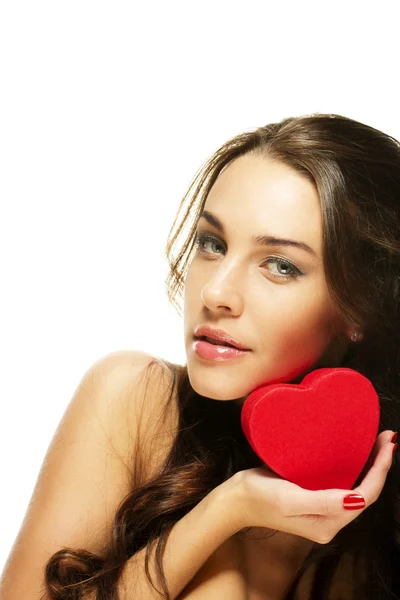 Beautiful woman holding small red heart — Stock Photo, Image