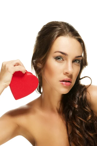Gorgeous woman holding red heart — Stock Photo, Image