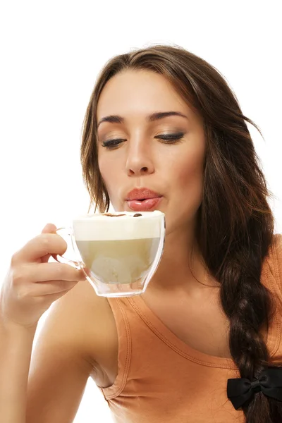 Beautiful woman blow to her hot cappuccino — Stock Photo, Image