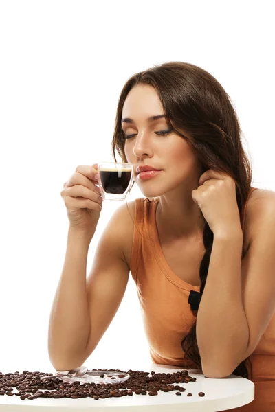 Beautiful woman scenting on espresso coffee — Stock Photo, Image