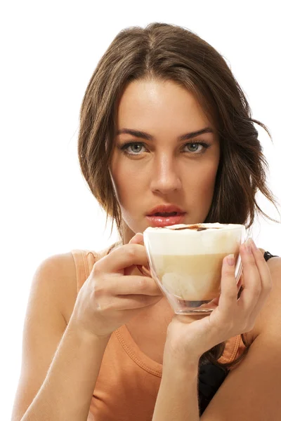 Young beautiful woman holding cappuccino coffee — Stock Photo, Image