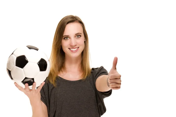Woman with a football showing thumbs up — Stock Photo, Image