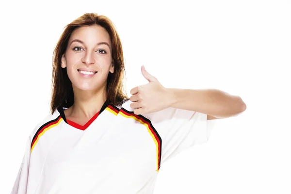 Jeune femme portant une chemise de football montrant pouce vers le haut — Photo