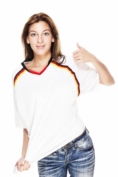 Young woman wearing jeans and football shirt showing thumb up — Stock Photo, Image