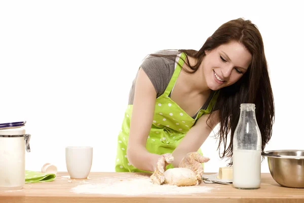 Young woman forming dough with her hands — Stock Photo, Image