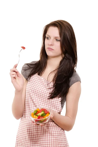 Young woman is suspicious about the salad — Stock Photo, Image